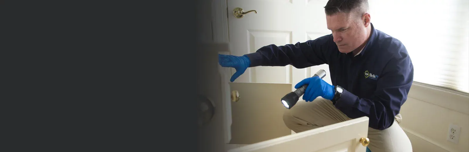 Service tech inspecting a home