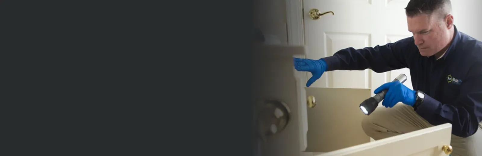 Service tech inspecting kitchen